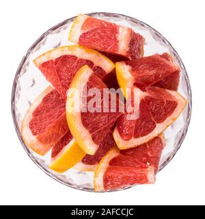 Portion of chopped Grapefruits isolated on white background (close-up shot) Stock Photo