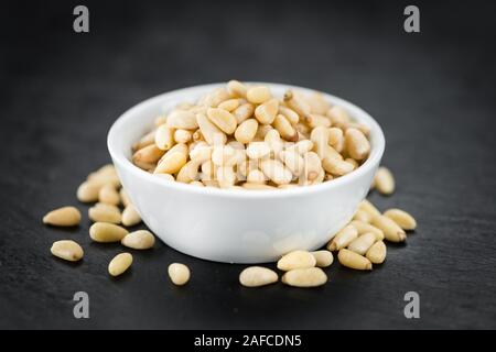 Pine Nuts on a vintage background as detailed close-up shot (selective focus) Stock Photo