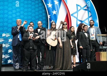 Hollywood, United States Of America. 07th Dec, 2019. President Donald J. Trump applauds the Shalva Band, performers at the Israeli American Council National Summit Saturday, Dec. 7, 2019, in Hollywood, Fla People: President Donald J. Trump Credit: Storms Media Group/Alamy Live News Stock Photo