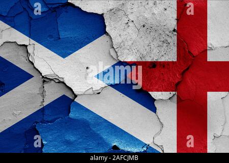 flags of Scotland and England painted on cracked wall Stock Photo