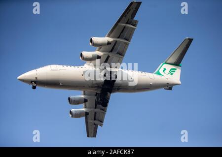 Beijing, China. 14th Dec, 2019. Photo taken on Dec. 14, 2019 shows an Airbus A340 of Mahan Air approaching the Mehrabad International Airport in Tehran, Iran. The U.S. Treasury on Wednesday imposed new sanctions on the Iranian airline of Mahan Air and its shipping industry, accusing it of 'transporting lethal aid from Iran to Yemen.' Iran's Civil Aviation Organization (CAO) dismissed any negative impact of recent U.S. sanctions on the Islamic Republic's airlines, Tehran Times daily reported on Friday. Credit: Ahmad Halabisaz/Xinhua/Alamy Live News Stock Photo