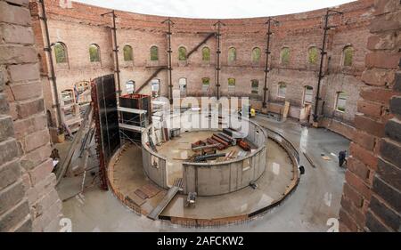 07 November 2019, Saxony-Anhalt, Halle (Saale): In the former gasometer at Holzplatz in Halle, the city of Halle is currently building a new planetarium with an investment of 14.4 million euros from flood funds. The new building is a special place for extracurricular and cultural education. (to dpa 'Planetarium Halle wants to offer more than sun, moon and stars'). Photo: Peter Endig/dpa-Zentralbild/dpa Stock Photo