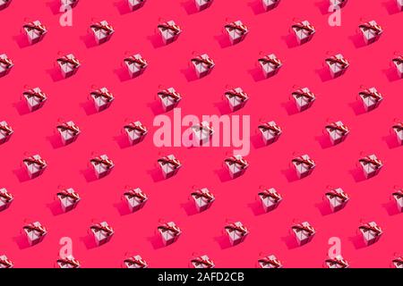 Christmas holiday present composition. Gift, christmas new year and sale concept pattern decoration on pink background Stock Photo