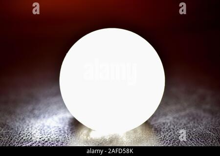 Glowing crystal ball on a dark background. Future reading concept Stock Photo