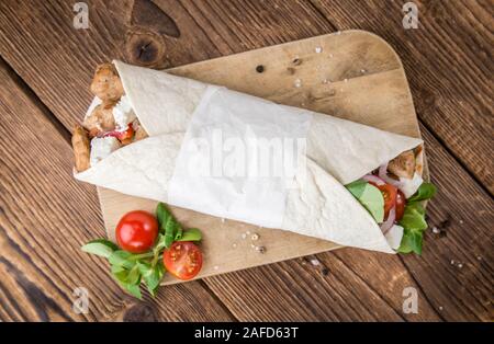 Homemade Chicken Wrap (close-up shot) on vintage background (selective focus) Stock Photo