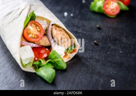 Homemade Chicken Wrap (close-up shot) on vintage background (selective focus) Stock Photo