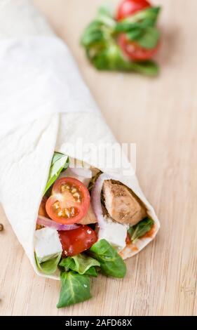 Homemade Chicken Wrap (close-up shot) on vintage background (selective focus) Stock Photo