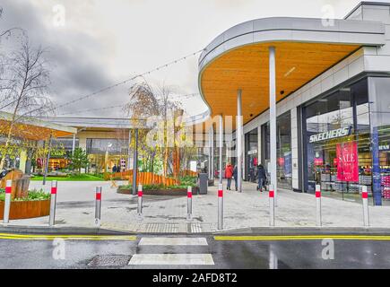 Shopping arcade at Rushden Lakes shopping centre on a wet and rainy winter day. Stock Photo