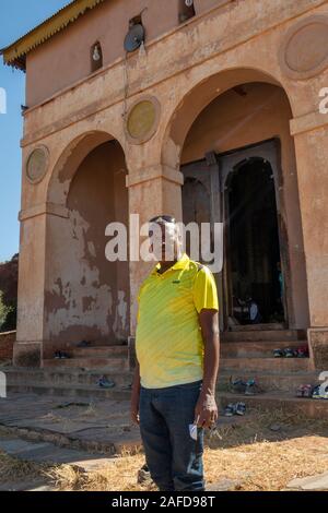 Ethiopia, Tigray, Wukro, Abraha we Atsbeha, C10th church, man stood outside Stock Photo