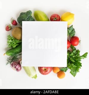 Organic Food Background - assorted fruits and vegetables isolated on white, creative layout with copy space. Healthy clean eating, diet concept. Stock Photo