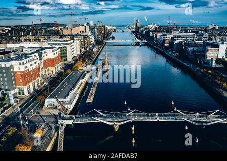 Aerial Dublin city view over Liffey River .Samuel Beckt and Sean O' Casey Bridge Stock Photo