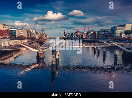 Aerial Dublin city view over Liffey River .Samuel Beckt and Sean O' Casey Bridge. Stock Photo