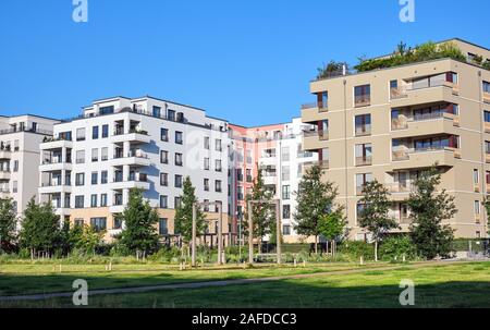 Modern apartment houses with a green park seen in Berlin, Germany Stock Photo