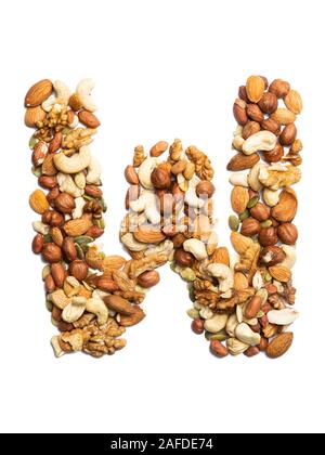 Letter W of the English alphabet from a mixture of hazelnuts, almonds, walnuts, peanuts, cashews, pumpkin seeds on a white isolated background. Food p Stock Photo