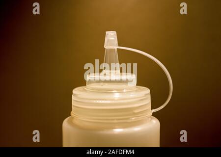 plastic bottle used by chefs in kitchen to make decorations on plates Stock Photo