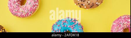 Color donut pattern on yellow background, long banner Stock Photo