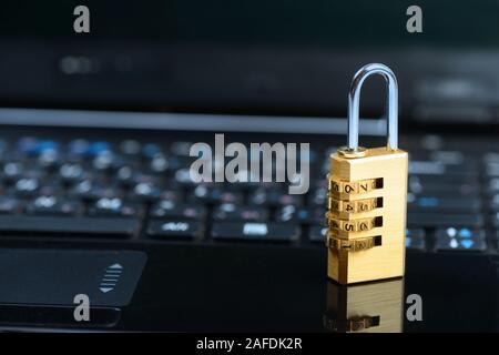 Combination lock on notebook laptop computer. Cyber safety concept Stock Photo