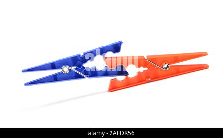 Household clothes pins on white background. Pair of color plastic clothespins. Fighting or competition concept Stock Photo