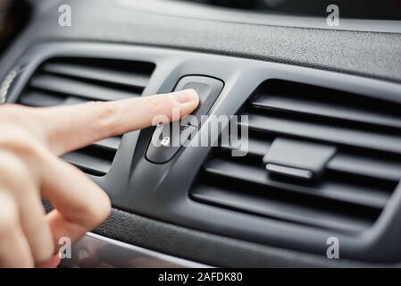 hand press emergency stop button in the car Stock Photo