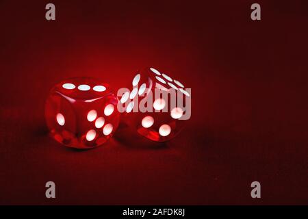 Two dices on gradient red background. Risk concept Stock Photo