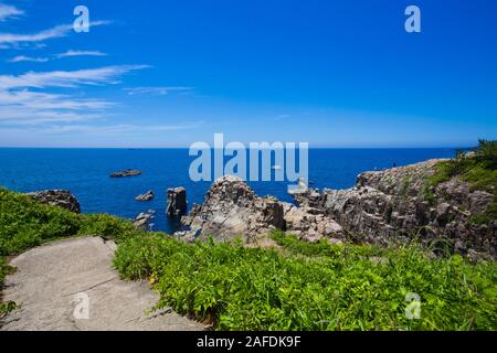 Scenery of Tojinbo cliff and tojinbo tower in Fukui prefecture, Japan Stock Photo