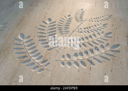 Hand Carving on Lime Stone in leaf pattern Stock Photo