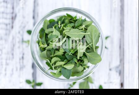 Wooden Table with fresh Menthol leaves (close-up shot; selective focus) Stock Photo