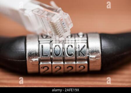 Computer internet cable and lock. Internet security concept. Internet cable and padlock with text LOCK Stock Photo