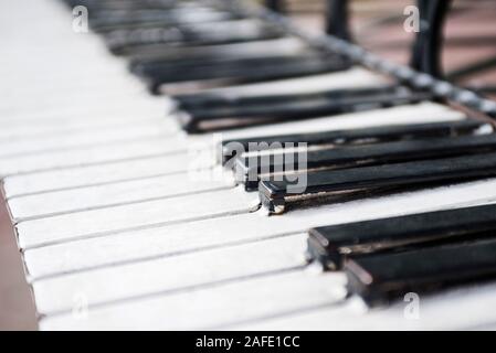 Piano keyboard. Grand piano keys closeup. Classical music instrument. Metal construction, monument. Stock Photo