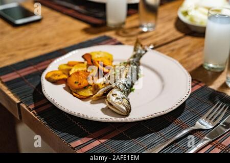 Turkish Bluefish with Raki / Lufer Fish. Traditional Seafood. Stock Photo