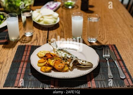 Turkish Bluefish with Raki / Lufer Fish. Traditional Seafood. Stock Photo