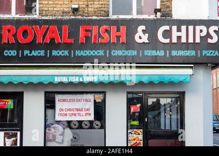 Free Christmas Day meals for the homeless at Royal Fish & Chips restaurant. Homeless eat free charity offer. Homelessness in Southend on Sea, Essex Stock Photo