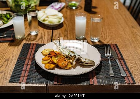 Turkish Bluefish with Raki / Lufer Fish. Traditional Seafood. Stock Photo