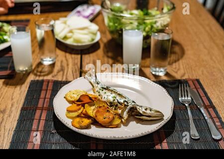 Turkish Bluefish with Raki / Lufer Fish. Traditional Seafood. Stock Photo