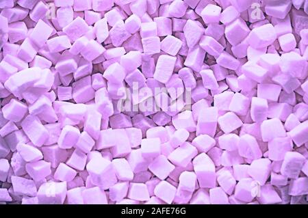 Marshmallows cubes are a lot of purple. Top view Stock Photo