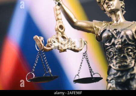 Law and Justice, Legality concept, Scales of Justice, Justitia, Lady Justice in front of the Russian flag in the background. Stock Photo
