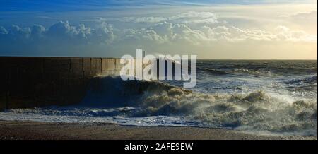 waves crashing on the marina arm Stock Photo