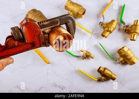 Pipe wrench brass plumbing fittings, heavy construction instruments Stock Photo