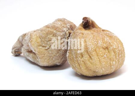 Image of two dried figs isolated on white background. Stock Photo