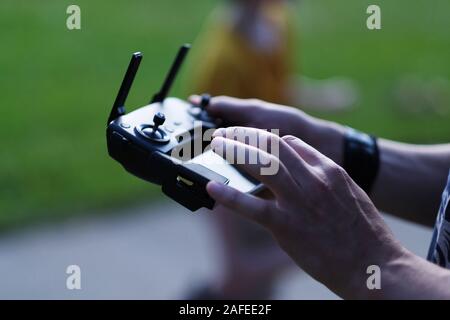 Control panel with joystick, antennas and touch screen in male hands Stock Photo