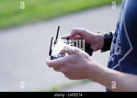 Control panel with joystick, antennas and touch screen in male hands Stock Photo