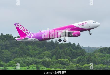 Tokyo, Japan - Jul 4, 2019.  JA815P Peach Airbus A320 taking-off from Tokyo Narita Airport (NRT). Narita is one of the busiest airports in Asia. Stock Photo