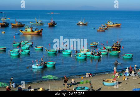 Phan Thiet, Vietnam - Mar 19, 2016. Fishing boats on blue sea in Phan Thiet, Vietnam. Phan Thiet has a bustling little fishing port with a harbor full Stock Photo