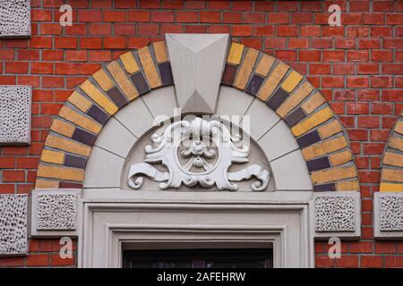 Elements of architectural decorations of buildings windows, arches and balustrade, gypsum stucco face, pilaster close up detail floral german style Stock Photo