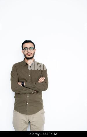 Young serious mixed-race businessman in casualwear looking at you in isolation Stock Photo