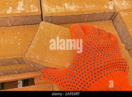 Worker is working on installing the pavement Stock Photo