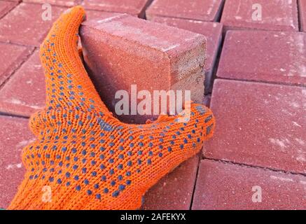 Worker is working on installing the pavement Stock Photo