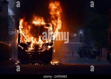 New Delhi, India. 15th Dec, 2019. Photo taken on Dec. 15, 2019 shows a passenger bus in flames in New Delhi, India. Protesters in Indian capital Sunday set ablaze several vehicles including three buses during their protest over new citizenship law in country, officials said. Credit: Str/Xinhua/Alamy Live News Stock Photo