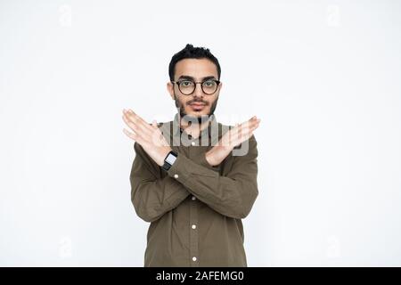 Guy crossing hands in front of himself meaning something that is forbidden Stock Photo