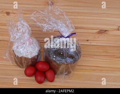 Easter holiday red eggs and Easter cakes Stock Photo